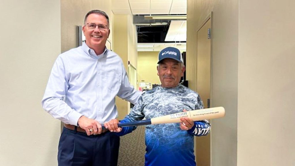 Halff CEO Mark Edwards presenting Home Run Award to Adolfo Vargas